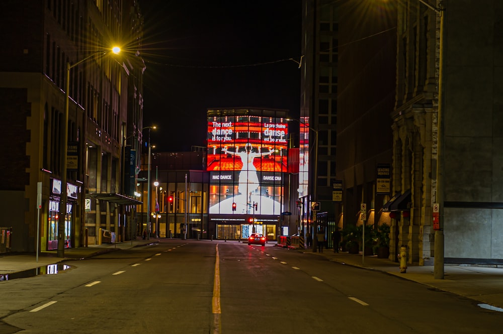 red and white lighted building during night time