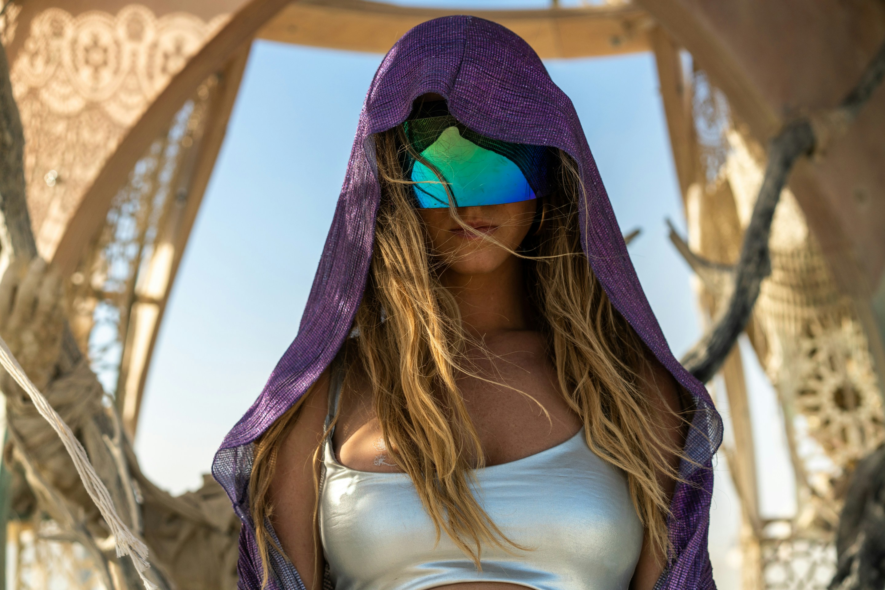 woman in white tank top and purple hijab