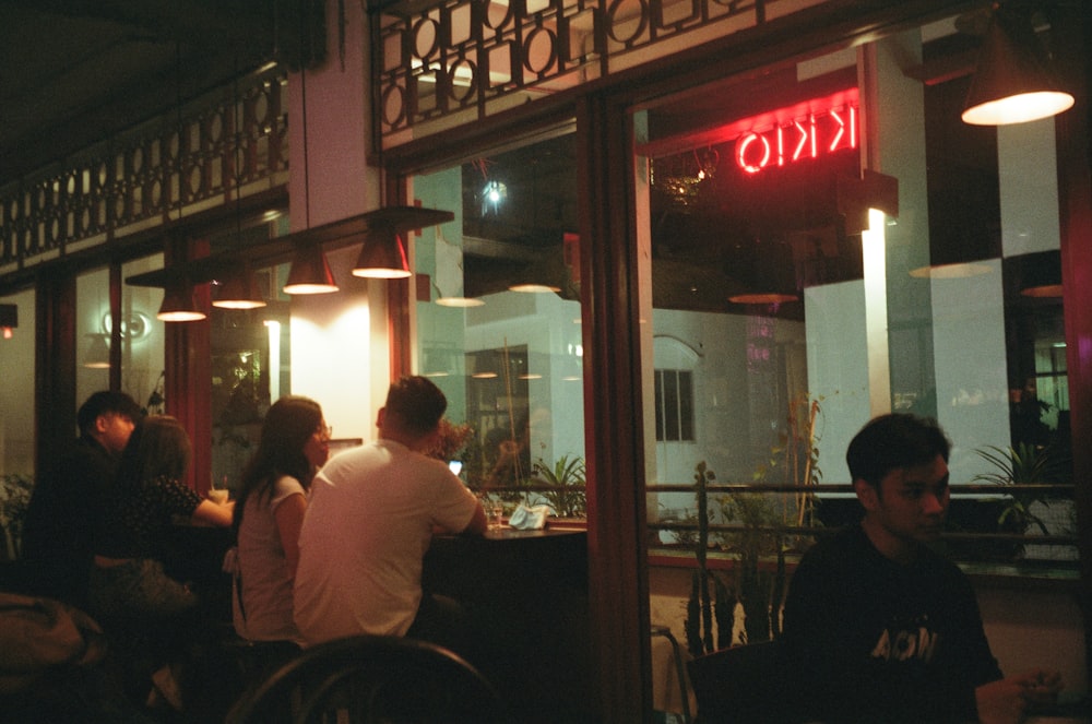 people sitting on chair in restaurant