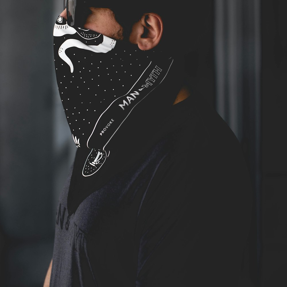 man in black and white nike hoodie wearing black and white nike mask