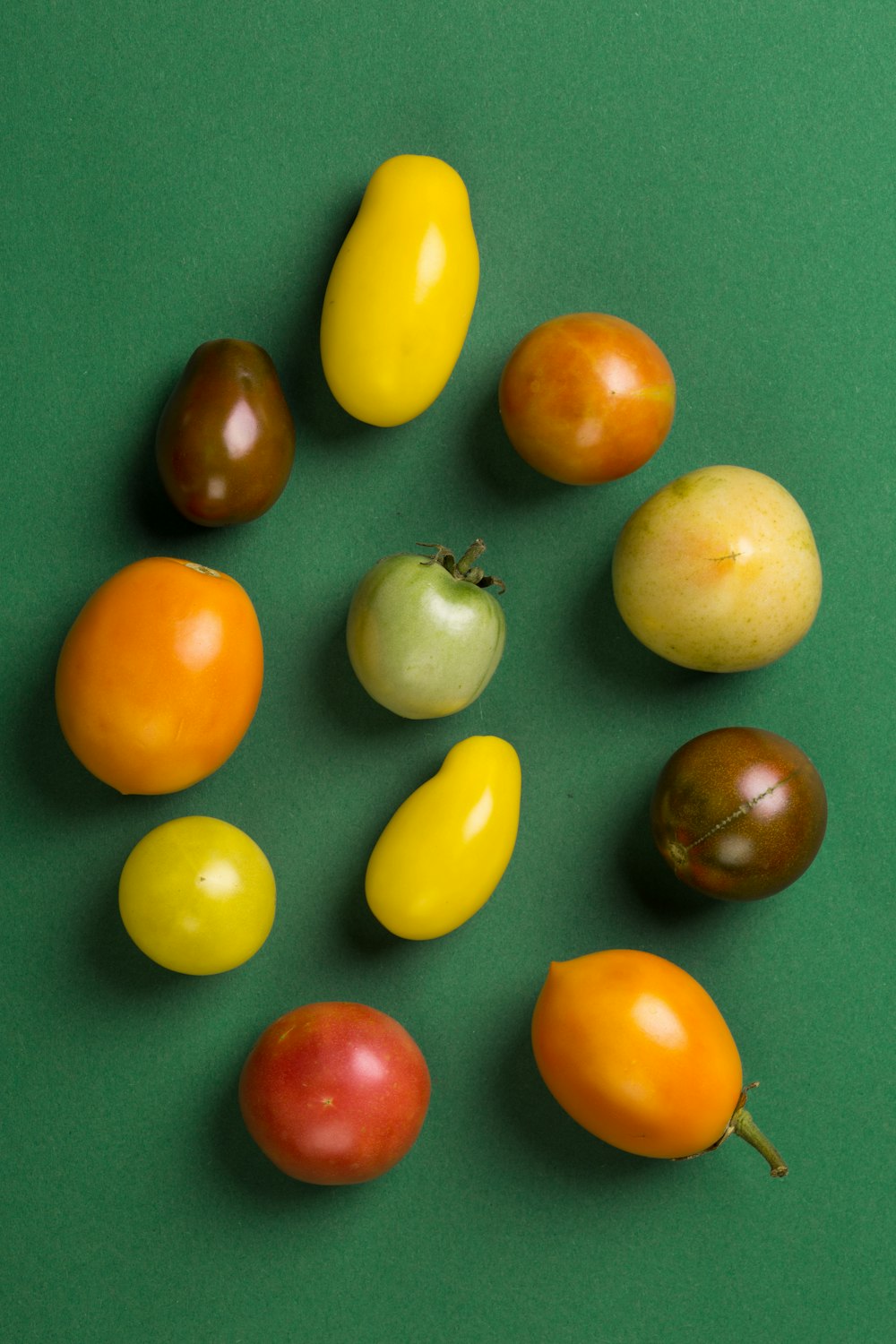 yellow and red tomato and yellow round fruit