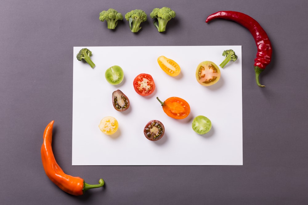 sliced vegetables and fruits on white table