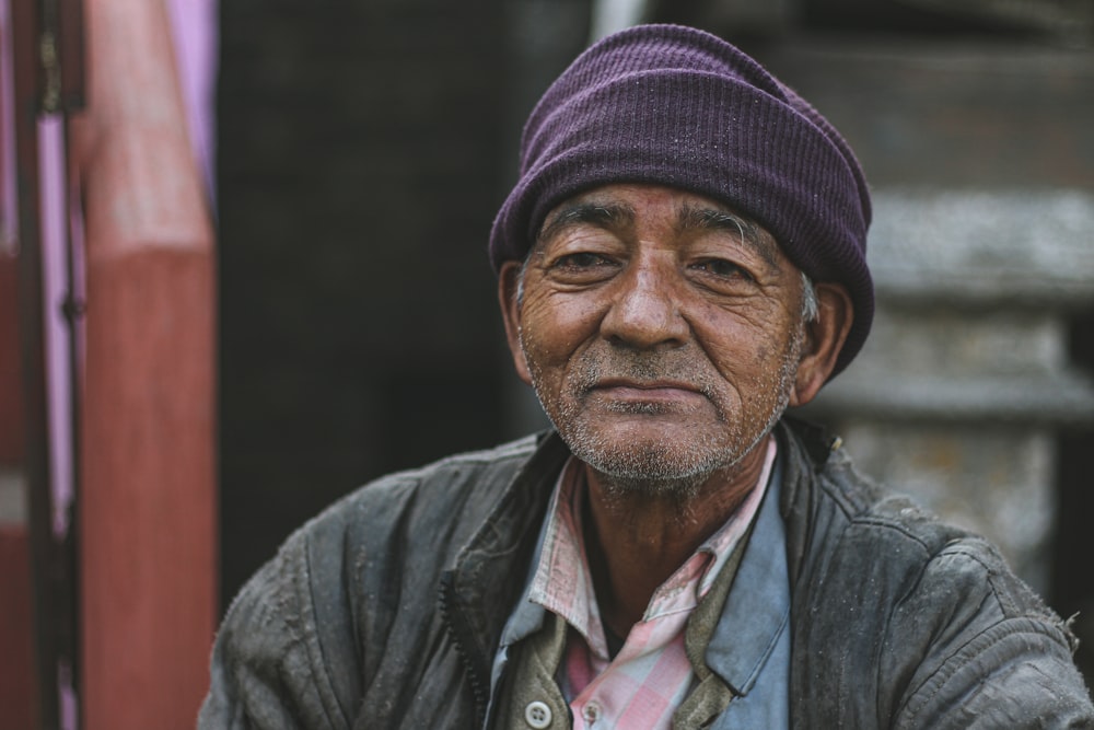 man in gray jacket and black knit cap