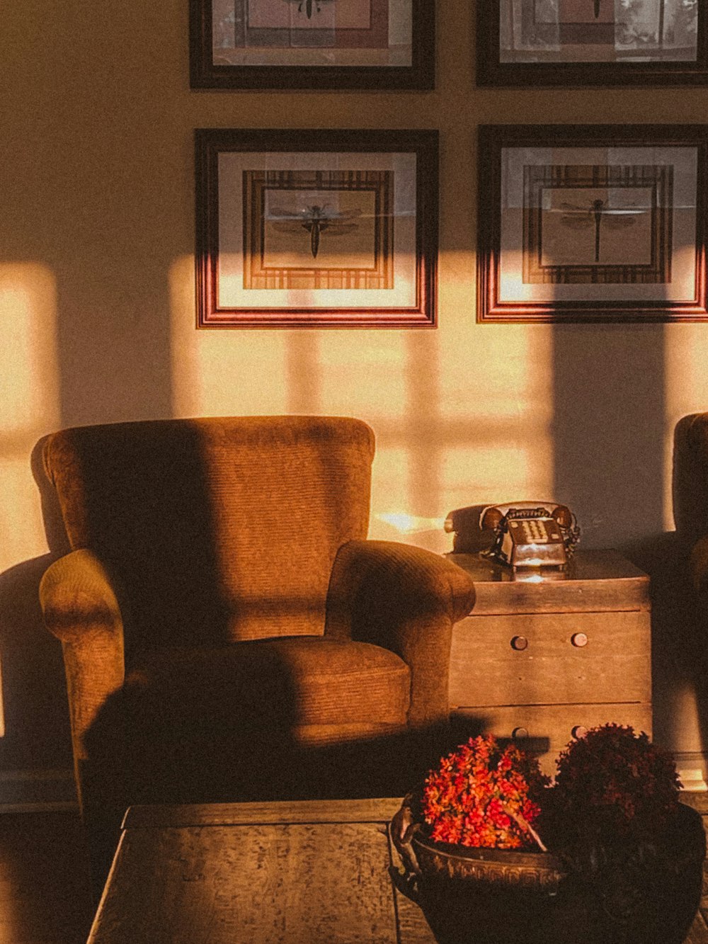 brown wooden 2 drawer chest beside brown sofa chair