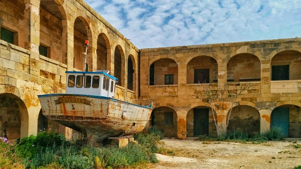 brown and white boat on river during daytime