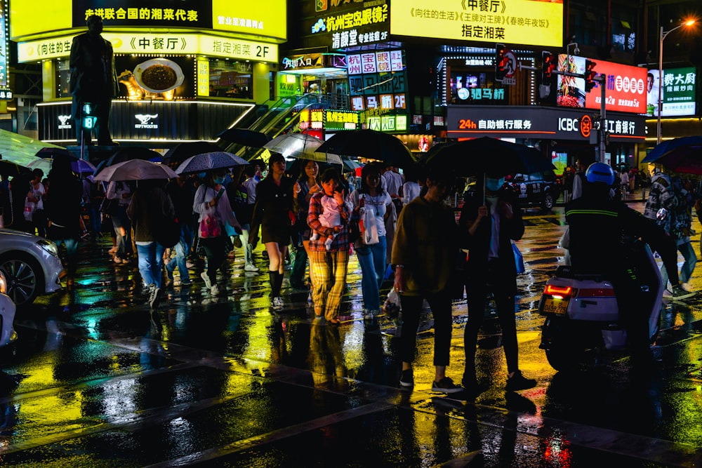 people walking on street during night time