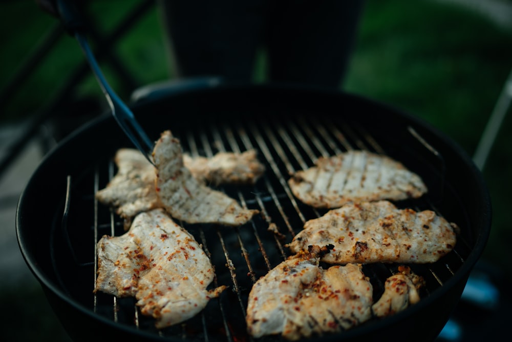 grilled meat on black charcoal grill