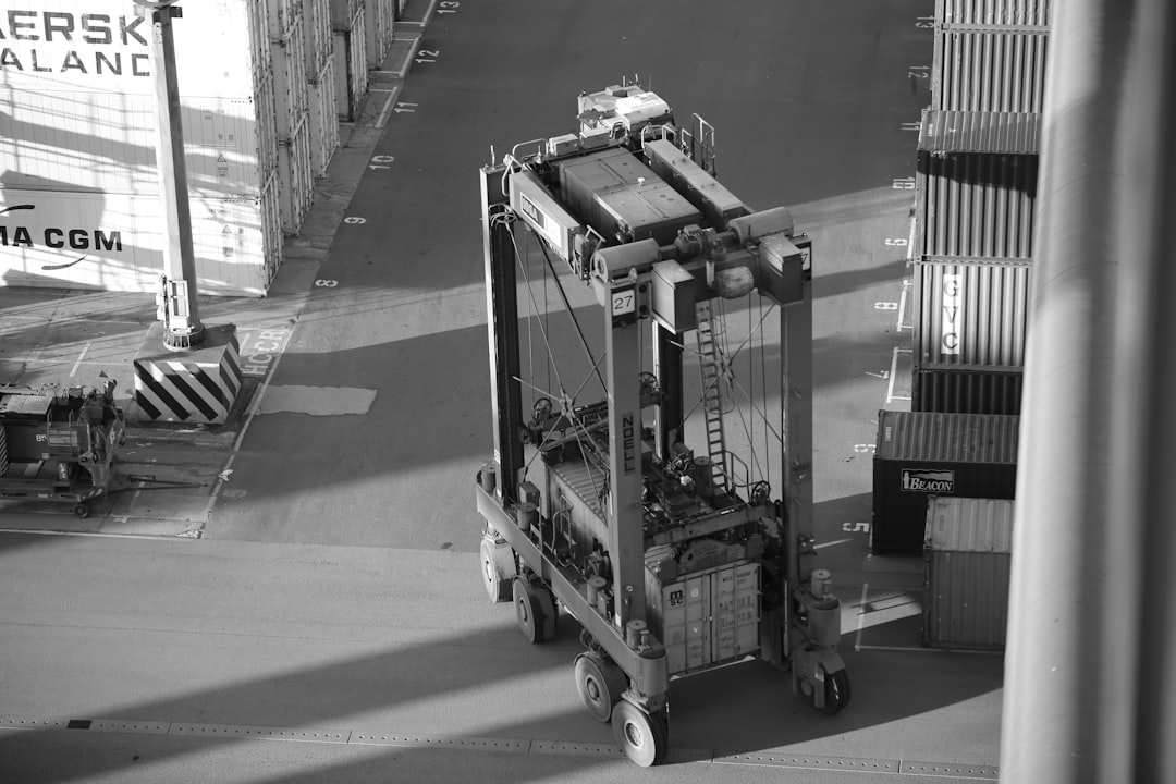 grayscale photo of a truck on a road