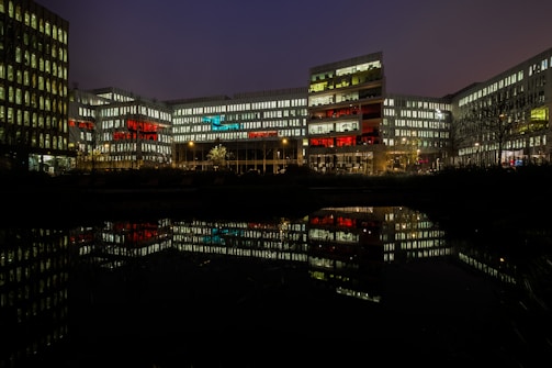 Modern office building with Mastercard brand colors lighting up the facade.