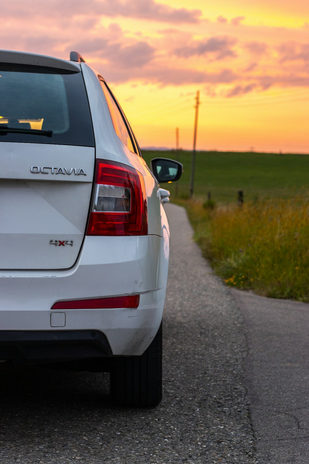 white car on road during sunset