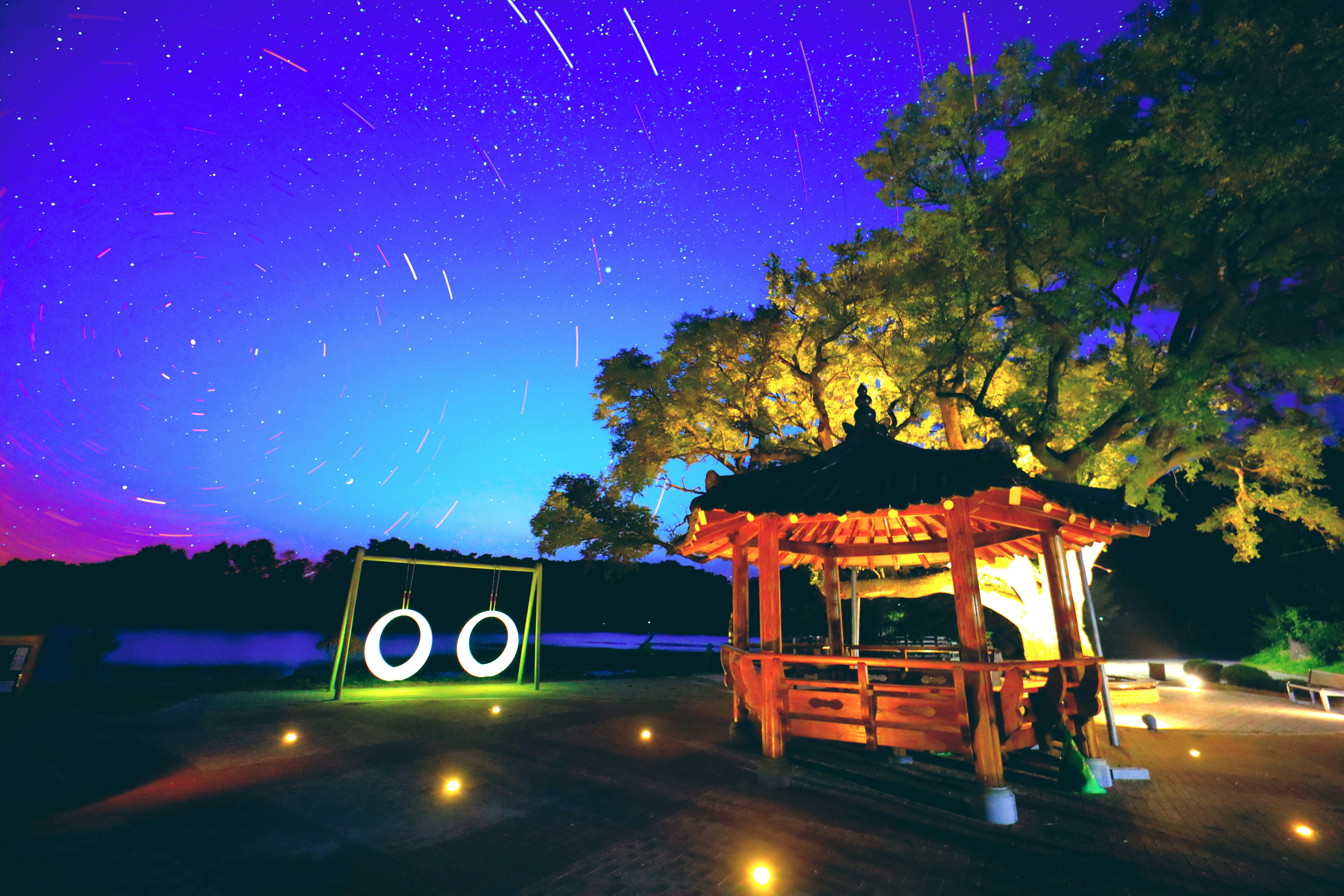 Japanese summer night with stars and fireflies