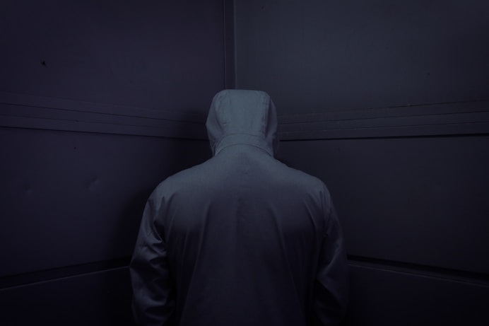 man in gray hoodie standing