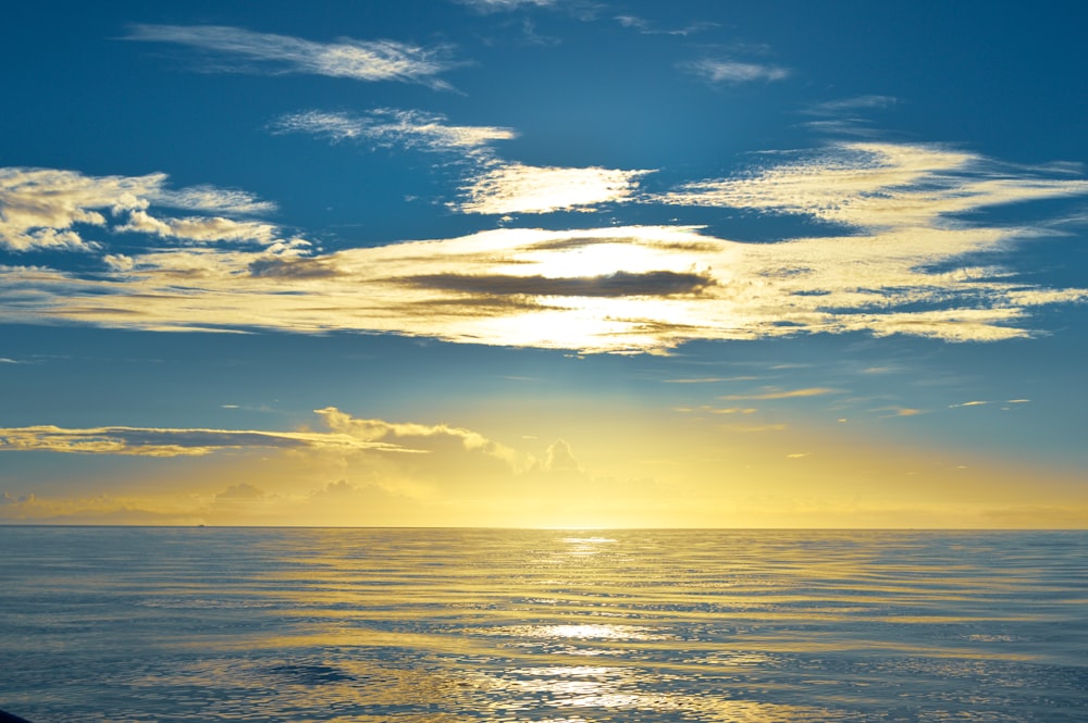 body of water during sunset