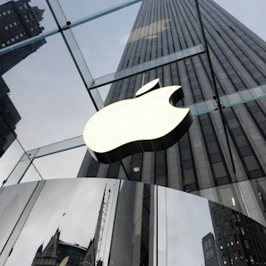 The Lamppost Technologies logo displayed on a glass wall inside the office, reflecting the city skyline.