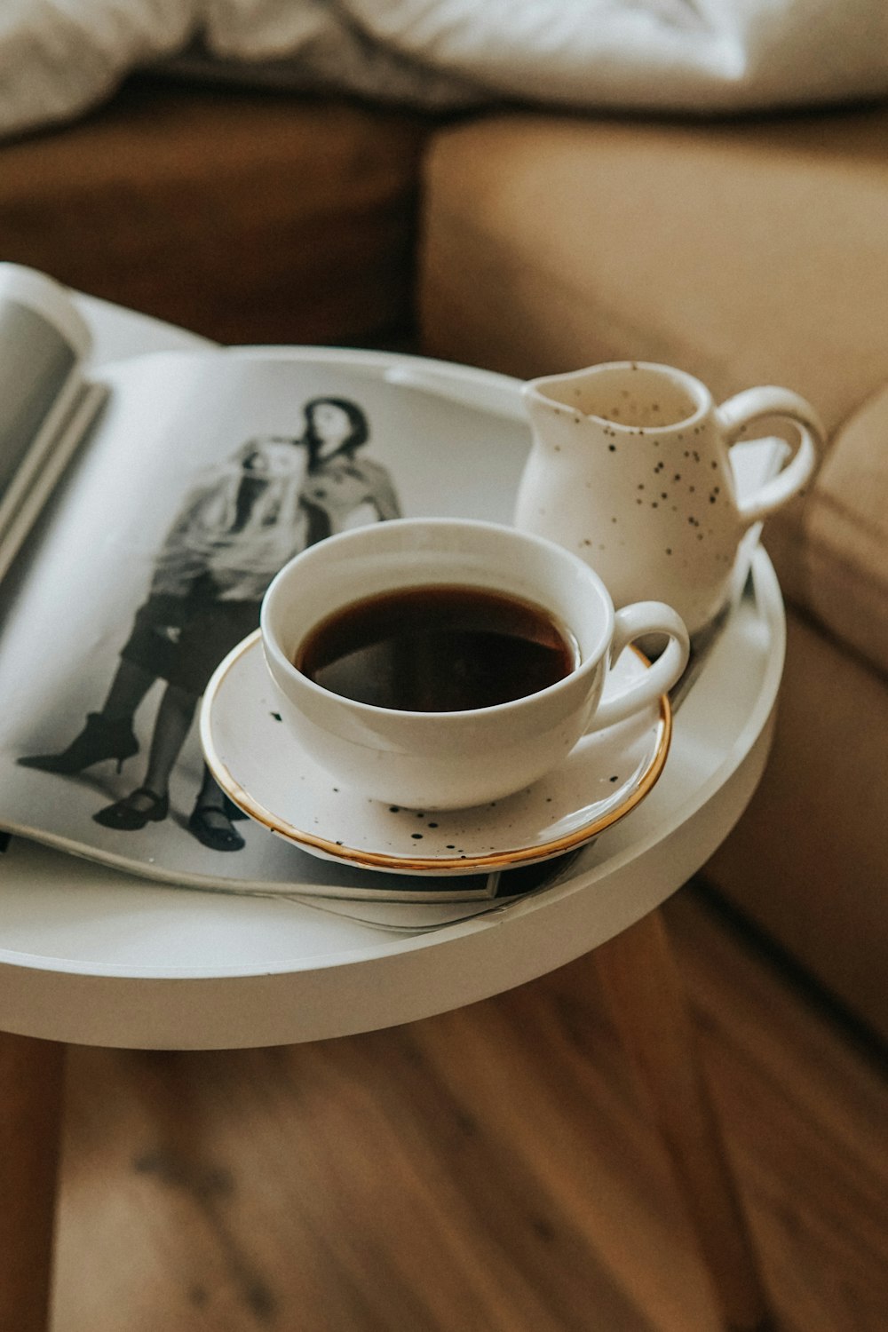 white ceramic teacup on white ceramic saucer