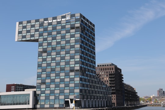 gray concrete building under blue sky during daytime in Schiemond Netherlands