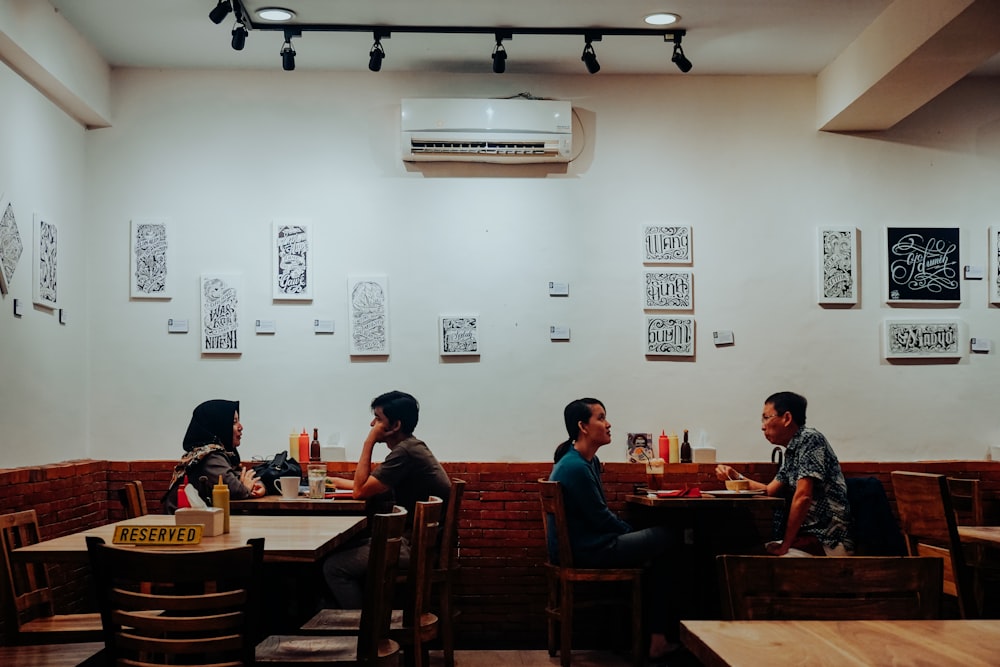 people sitting on chairs inside room