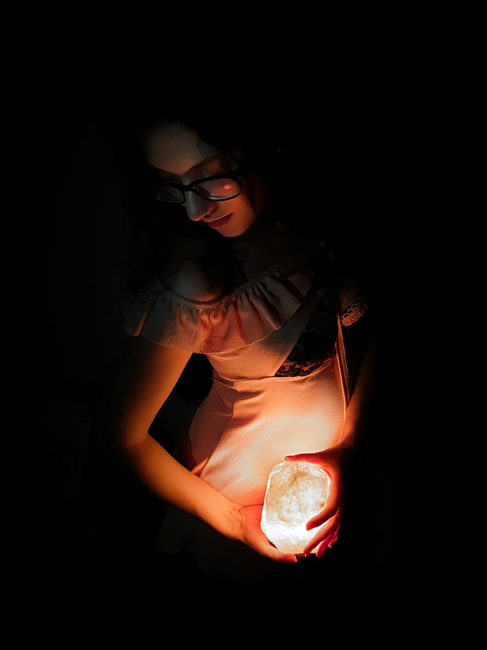 woman in black framed eyeglasses and brown shirt