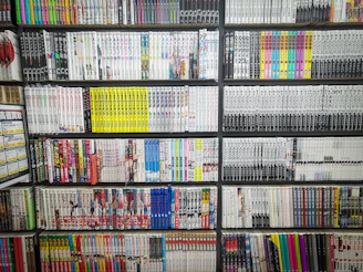books on black wooden shelf