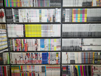 books on black wooden shelf