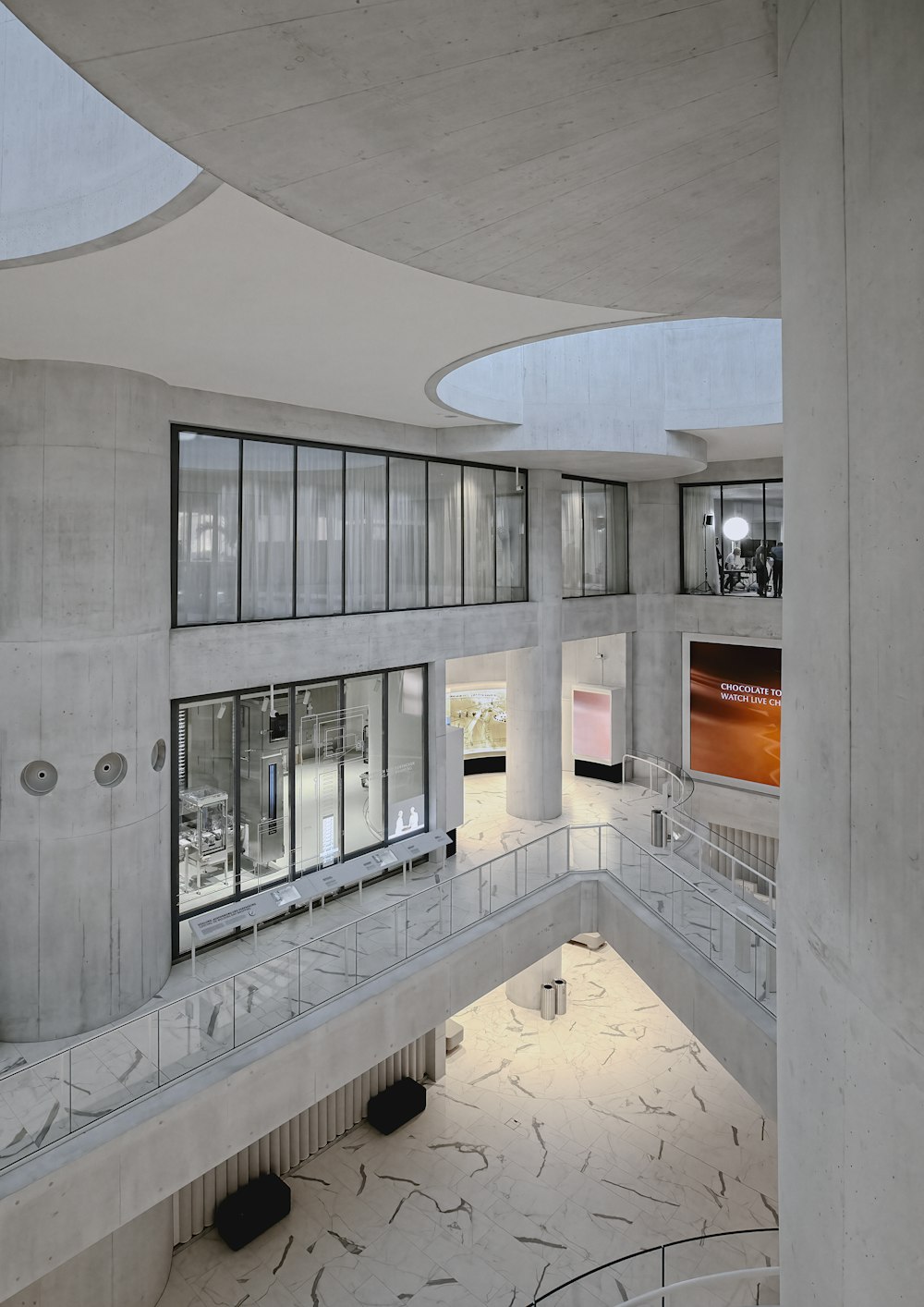 white concrete building with glass windows