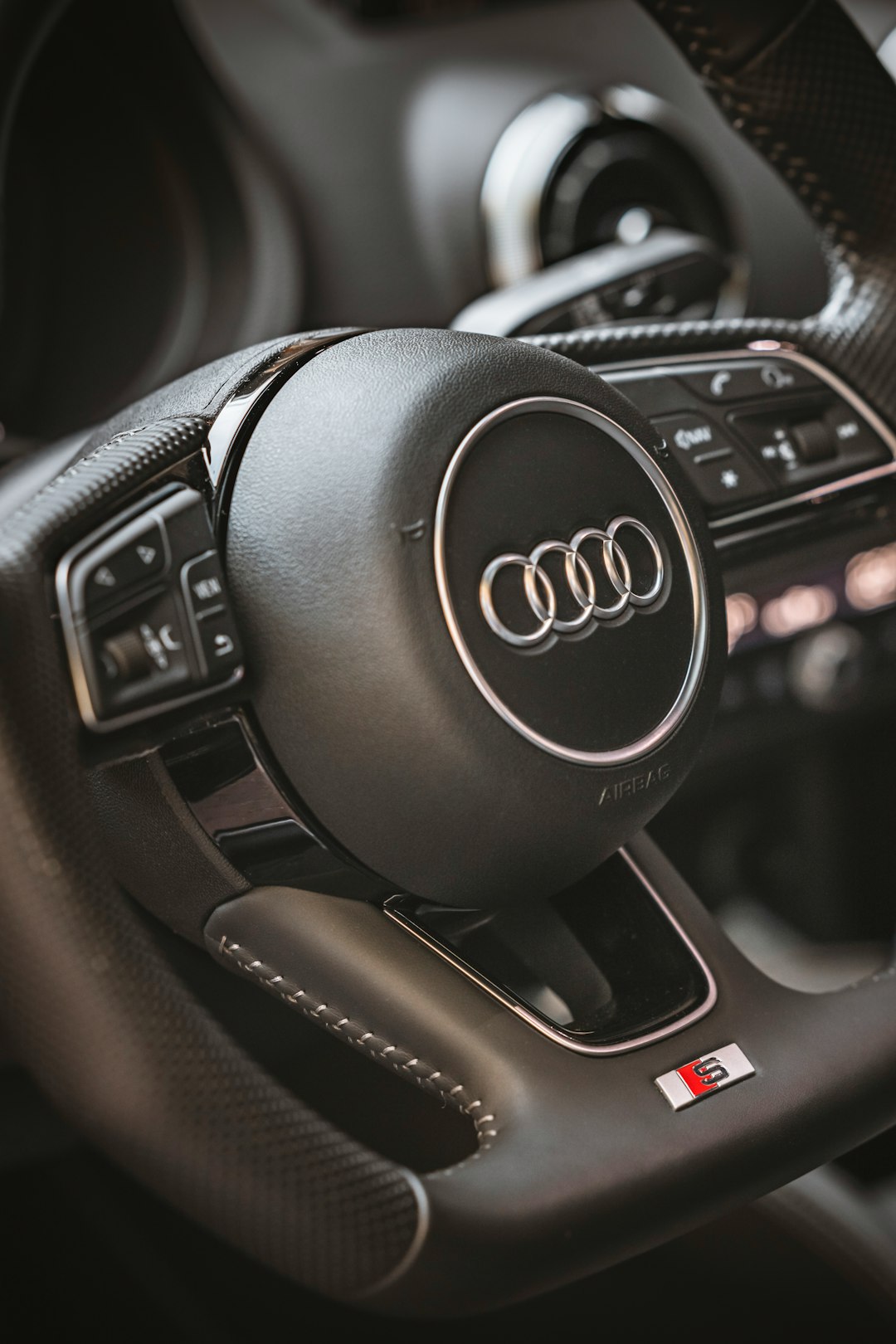 black and silver audi steering wheel