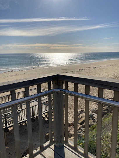 A serene beach view from the hotel balcony.