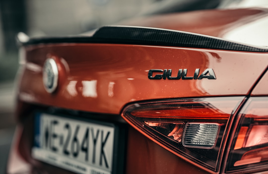 red and black car in close up photography