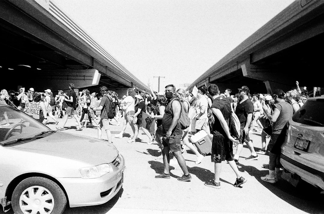 grayscale photo of people walking on street