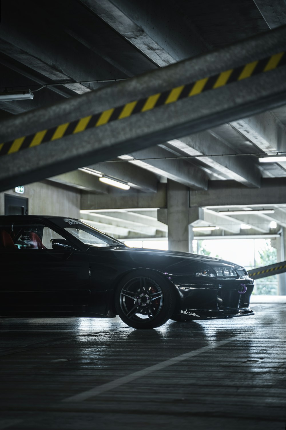 black porsche 911 parked in parking lot