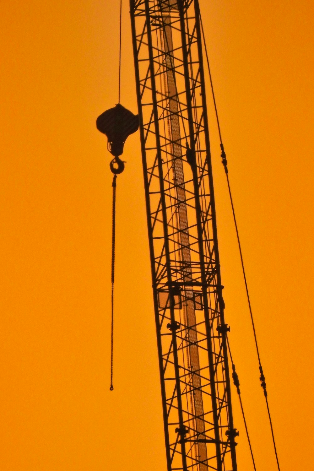 black street light under orange sky