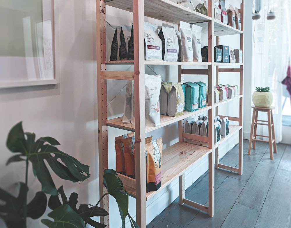 brown wooden shelf with books