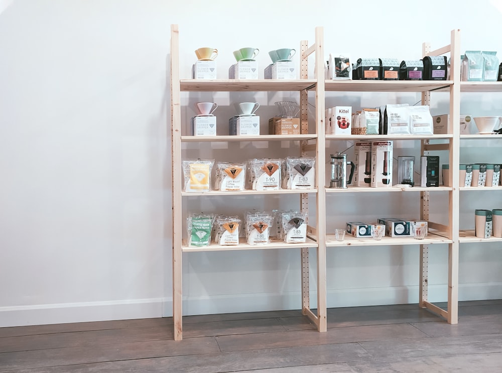 brown wooden shelf with bottles and jars