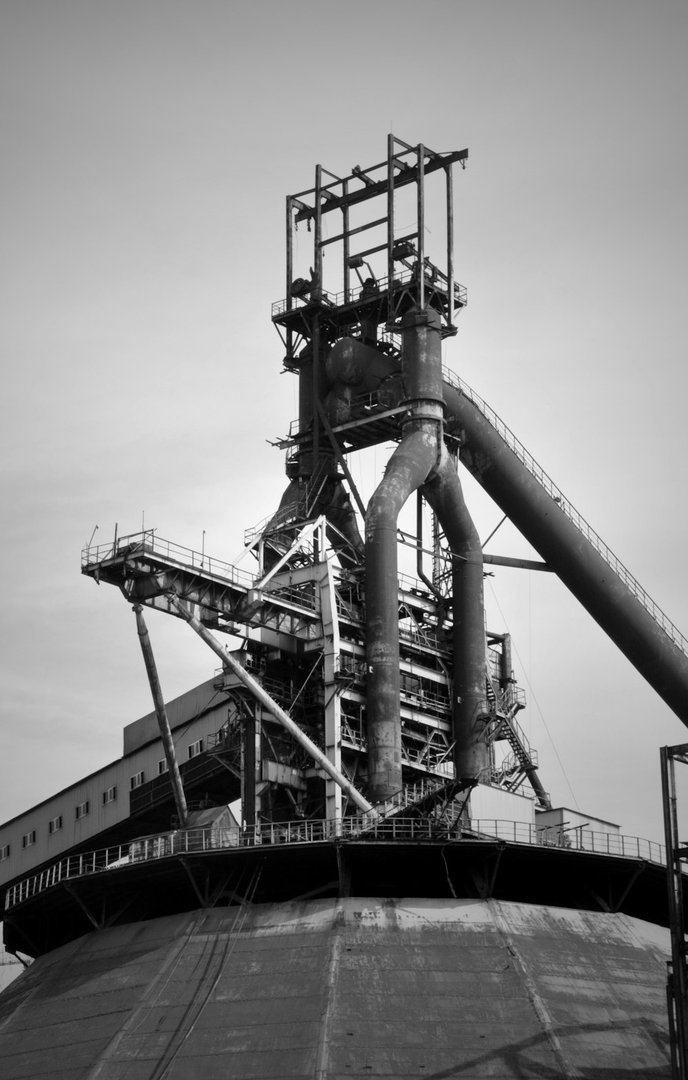 grayscale photo of metal tower