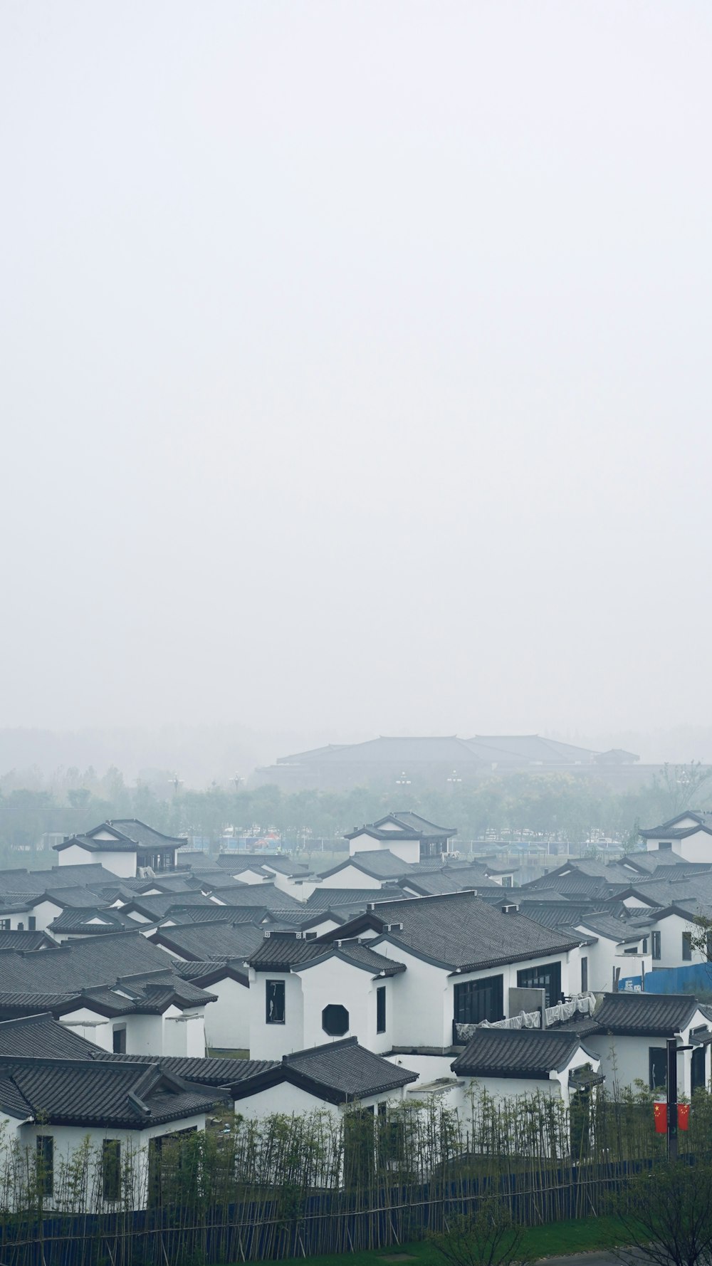 houses and buildings under white sky during daytime