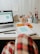 Modern office workspace with a laptop and notes, showing focused website design work.