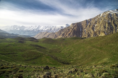 Gulmarg's lush green meadows with snow-capped peaks.
