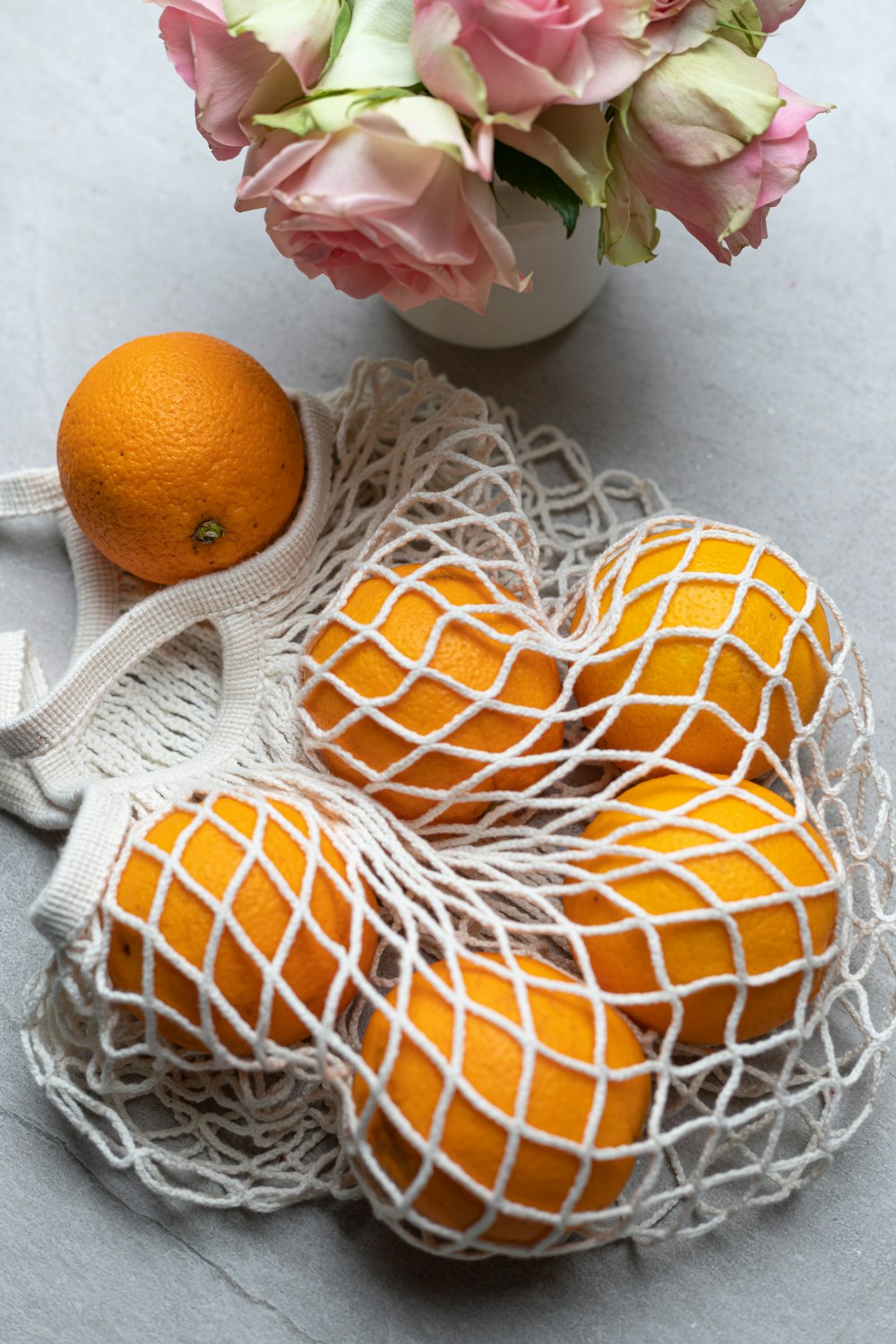 orange fruit on white knit textile