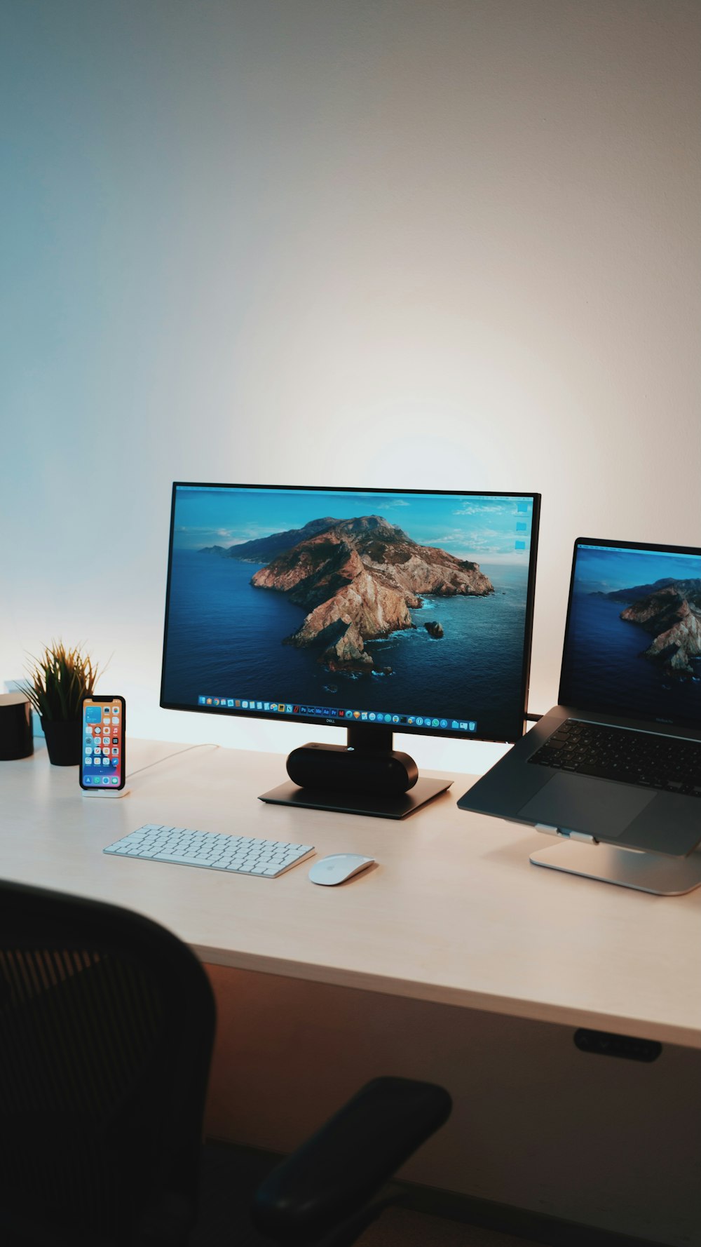 black flat screen computer monitor on white table