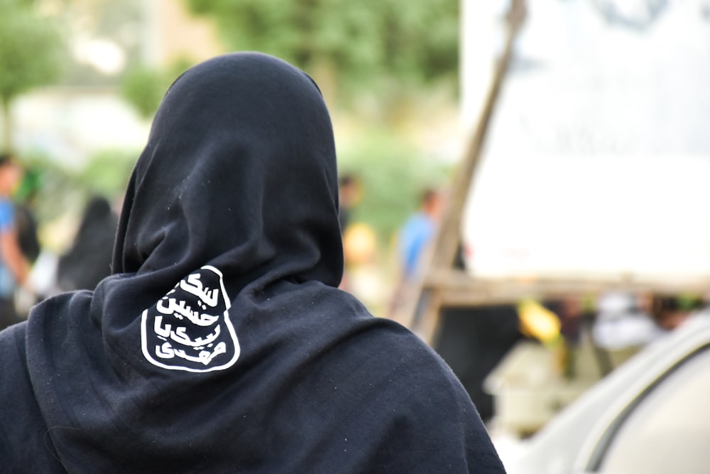 person in black and white hoodie