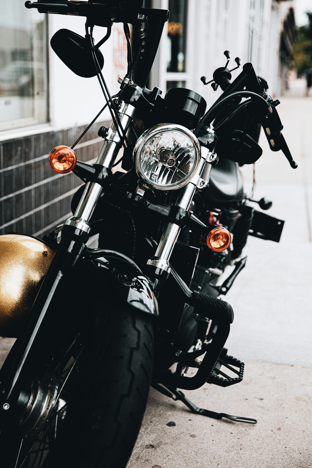 black motorcycle parked beside brown leather ball