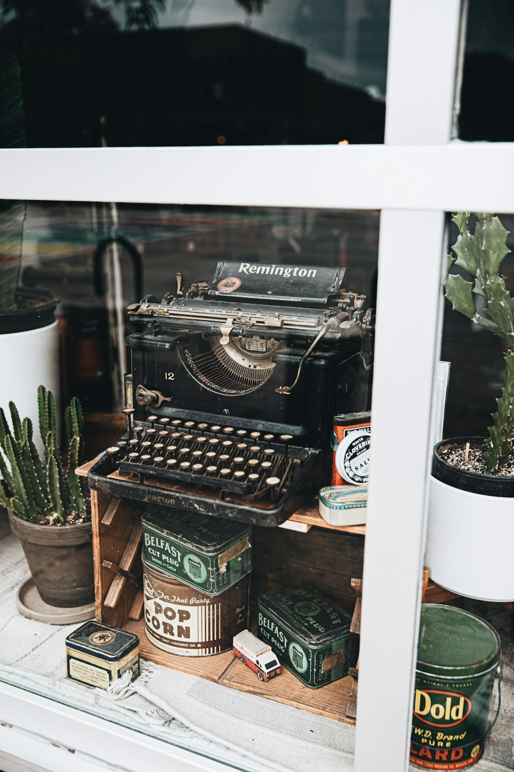 black and brown typewriter on brown wooden table