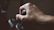 Close-up of a hand holding a sturdy electrical switch with a dark tech-inspired background.