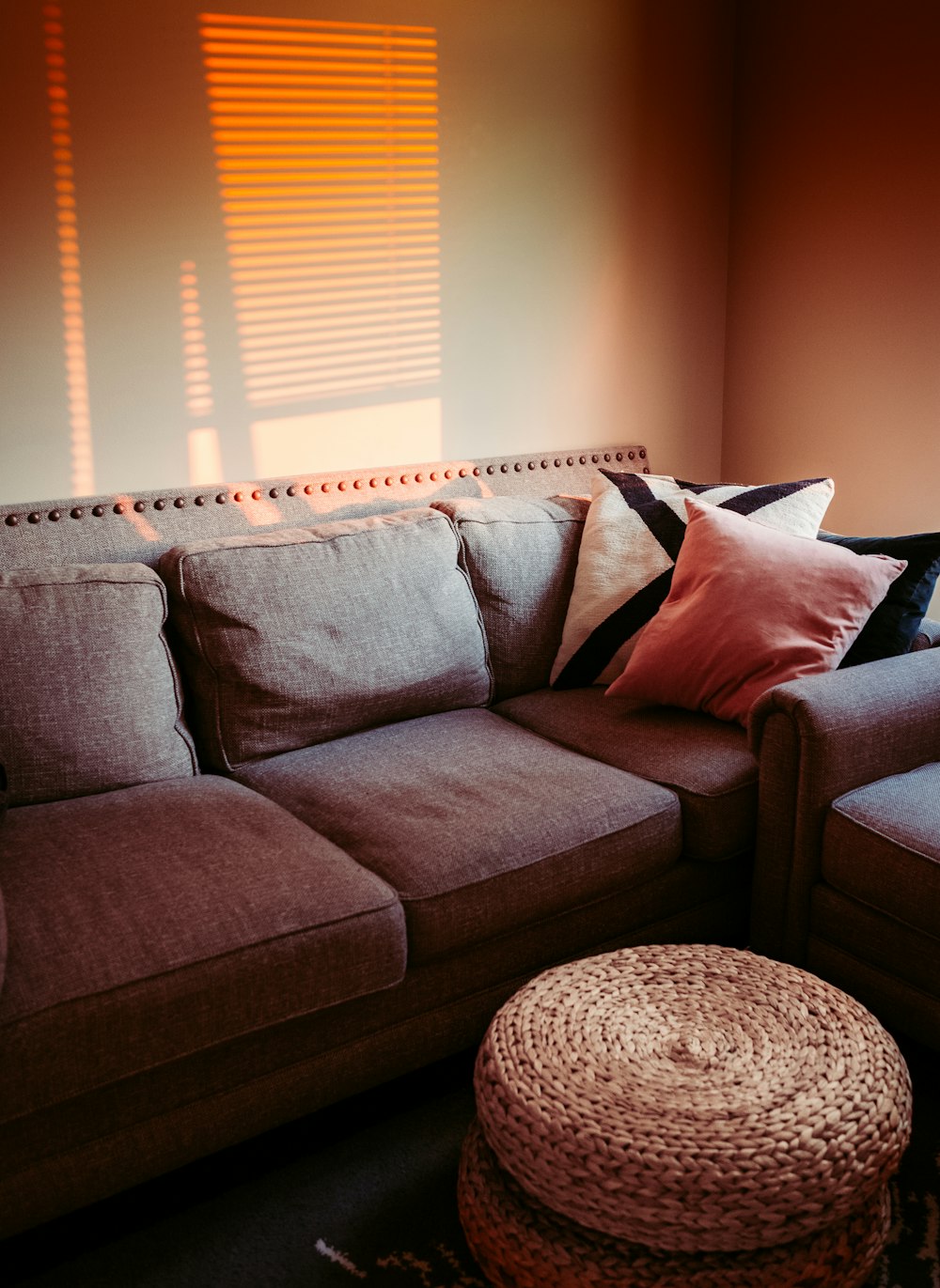 white throw pillow on gray couch