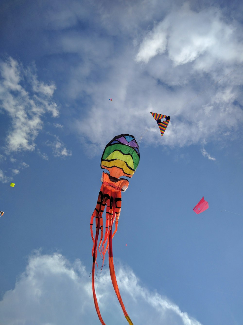 green yellow and red hot air balloon under blue sky