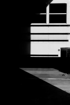 A striking photograph capturing natural light and shadow in an urban environment.