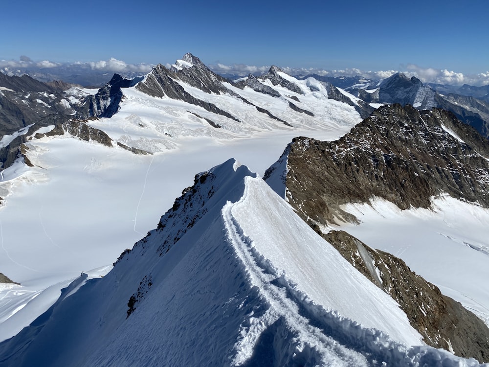 snow covered mountain during daytime