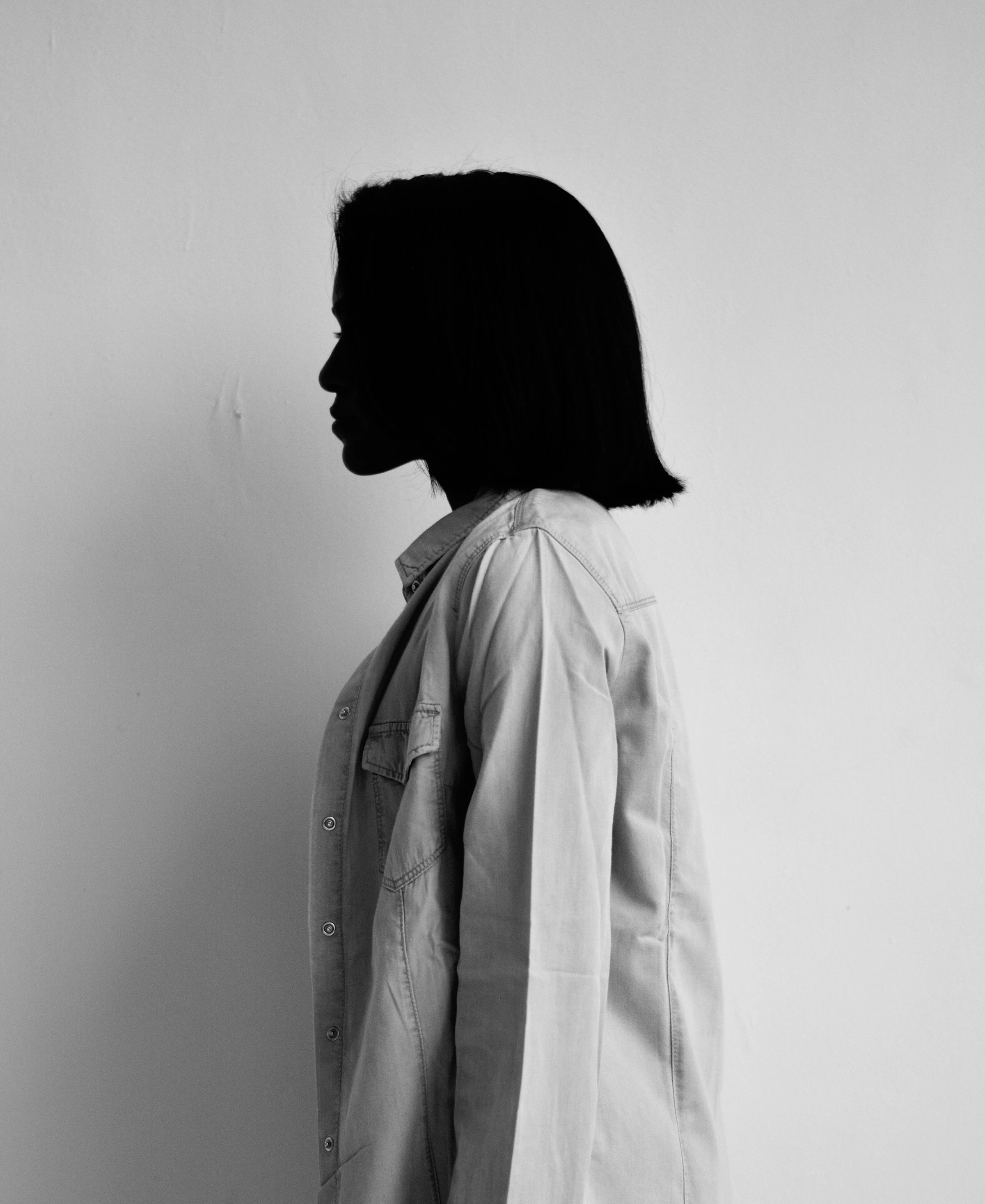 A model photographed in soft, bright studio light