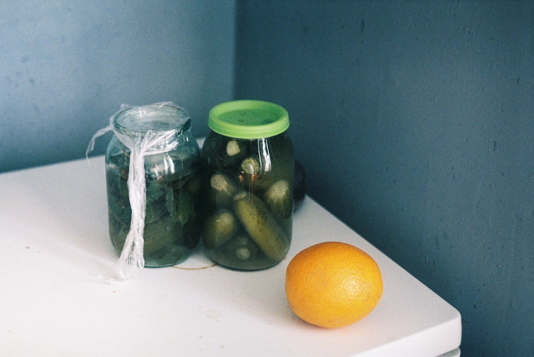 clear glass jar with green lid