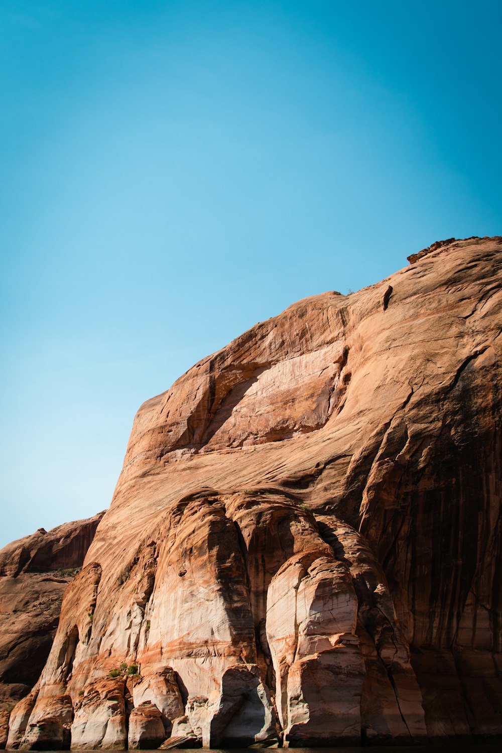 brown rocky mountain under blue sky during daytime